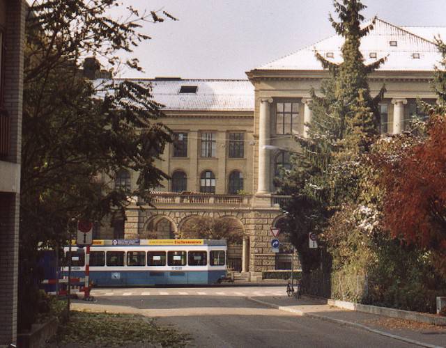 ETH building with snow and tram